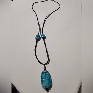 Vintage black beaded necklace with three glazed stoneware scarabs